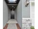 A welcoming entryway features stylish stone accents and modern lighting at 1886 Draughton Dr, Zephyrhills, FL 33541