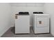 Convenient laundry room with side-by-side washer and dryer at 1886 Draughton Dr, Zephyrhills, FL 33541