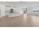 Open floor plan with spacious kitchen and living area with natural light at 1886 Draughton Dr, Zephyrhills, FL 33541