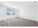 Bedroom with neutral carpet, ample light, and neighborhood view at 1876 Brekey Way, Zephyrhills, FL 33541
