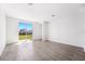 Bright living room with tiled floors and sliding glass doors to a backyard at 1876 Brekey Way, Zephyrhills, FL 33541