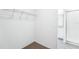 A walk-in closet space with shelving and carpeted floors at 1876 Brekey Way, Zephyrhills, FL 33541
