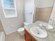 Bright bathroom featuring a single vanity, a toilet, and a bathtub at 4000 Barbary Ln, North Port, FL 34287