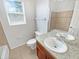 Bright bathroom features a granite vanity top, tile flooring, and a soaking tub at 4000 Barbary Ln, North Port, FL 34287