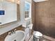 Updated bathroom with a tiled shower, granite countertop, new faucet, and natural light from the window at 4000 Barbary Ln, North Port, FL 34287