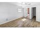 Bright bedroom featuring wood floors, a ceiling fan, and a bathroom at 4000 Barbary Ln, North Port, FL 34287