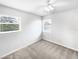 Cozy bedroom with carpet, two windows, and a ceiling fan at 4000 Barbary Ln, North Port, FL 34287