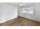 Bright bedroom with wood floors and a ceiling fan at 4000 Barbary Ln, North Port, FL 34287