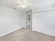 Bedroom with carpet, a ceiling fan, and closet at 4000 Barbary Ln, North Port, FL 34287