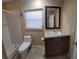 Bathroom featuring a tiled walk-in shower, window for natural light, and single sink at 231 W Cornelius Cir, Sarasota, FL 34232