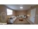 Staged living room featuring white sofas, decorative rug, and a bright, inviting atmosphere at 231 W Cornelius Cir, Sarasota, FL 34232