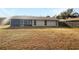 The home features a spacious backyard, and a screened-in porch at 14315 Knoll Ridge Dr, Tampa, FL 33625