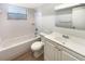 Bright and clean bathroom with a tub-shower combo, white tile, and a new-looking vanity at 14315 Knoll Ridge Dr, Tampa, FL 33625