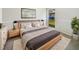 Comfortable bedroom featuring a large bed, soft carpet and a window bringing in natural light at 14315 Knoll Ridge Dr, Tampa, FL 33625