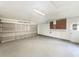 Spacious garage with ample room for storage, and featuring a steel garage door at 14315 Knoll Ridge Dr, Tampa, FL 33625