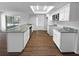 Beautiful kitchen featuring a large island with gray marble countertops and stainless steel appliances at 14315 Knoll Ridge Dr, Tampa, FL 33625
