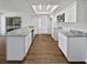Beautiful kitchen featuring a large island with gray marble countertops and stainless steel appliances at 14315 Knoll Ridge Dr, Tampa, FL 33625