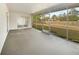 Screened-in back patio perfect for outdoor dining and relaxing, overlooking a fenced in backyard at 14315 Knoll Ridge Dr, Tampa, FL 33625