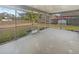 The screened porch opens up to a spacious backyard, perfect for enjoying the outdoors at 14315 Knoll Ridge Dr, Tampa, FL 33625
