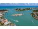 Breathtaking aerial view of the coastline with turquoise waters and boat docks at 500 The Esplanade N # 405, Venice, FL 34285