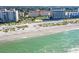 Stunning aerial view of beachfront condos along the shoreline with emerald green waters at 500 The Esplanade N # 405, Venice, FL 34285
