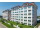 Exterior view of building, showing lawns and landscaping at 500 The Esplanade N # 405, Venice, FL 34285