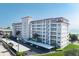 Exterior view of building, showing balconies, parking, and landscaping at 500 The Esplanade N # 405, Venice, FL 34285