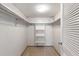 Bright closet featuring shelving, hanging rods, and a neutral carpet at 500 The Esplanade N # 405, Venice, FL 34285
