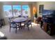 Inviting dining room featuring a wooden table with seating and a large window with ocean views at 500 The Esplanade N # 405, Venice, FL 34285