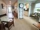 Welcoming entryway with tile floors, leading to the kitchen and other rooms, showcasing ample natural light at 500 The Esplanade N # 405, Venice, FL 34285