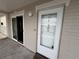 Exterior view of unit 405 with a front door and sliding glass door at 500 The Esplanade N # 405, Venice, FL 34285