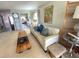 Bright living room featuring neutral tones, decor, and open access to other living areas at 500 The Esplanade N # 405, Venice, FL 34285
