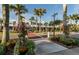 Charming shopping district with palm trees and colorful flowers at 500 The Esplanade N # 405, Venice, FL 34285