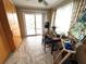Creative studio space with an easel, work desk, natural light, storage and balcony access at 500 The Esplanade N # 405, Venice, FL 34285