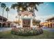Charming 'Welcome to Historic Downtown Venice' sign with colorful flowers and palm trees at 500 The Esplanade N # 405, Venice, FL 34285