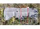 Overhead view of home showing roof, landscaping, mature trees, and neighboring property at 4215 Edgewood Dr, Holiday, FL 34691