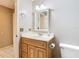 Bathroom featuring vanity with cabinets and mirror, and a toilet at 4215 Edgewood Dr, Holiday, FL 34691