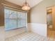 Charming dining area featuring a large window and white chair rail at 4215 Edgewood Dr, Holiday, FL 34691