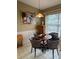 Cozy dining area with a round table and natural lighting at 4215 Edgewood Dr, Holiday, FL 34691