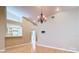 Bright dining room with hardwood floors, and stylish lighting fixture at 4215 Edgewood Dr, Holiday, FL 34691