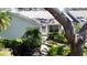 Well-maintained home exterior with inviting front entrance and manicured bushes at 4215 Edgewood Dr, Holiday, FL 34691