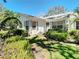 Single-story home featuring tidy landscaping, well-manicured lawn, and gray shutters at 4215 Edgewood Dr, Holiday, FL 34691