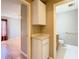Hallway featuring cabinets, with views of a bedroom and bathroom at 4215 Edgewood Dr, Holiday, FL 34691