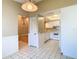 The kitchen has a light and airy floorplan with white tile flooring at 4215 Edgewood Dr, Holiday, FL 34691