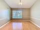Bright and spacious living room with hardwood floors and large windows at 4215 Edgewood Dr, Holiday, FL 34691