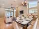 Open-concept living and dining area with modern furnishings and plenty of natural light at 4215 Edgewood Dr, Holiday, FL 34691