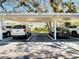 Covered parking spots labeled 4213, 4215, and 4217, with multiple cars at 4215 Edgewood Dr, Holiday, FL 34691