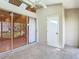 Sunroom featuring skylights, ceiling fan, and sliding glass doors to the backyard at 4215 Edgewood Dr, Holiday, FL 34691