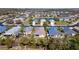 Real estate aerial view showing single Gathering homes and a pond in this desirable neighborhood at 5320 Aqua Breeze Dr, Bradenton, FL 34208