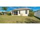 A well-kept backyard with lush green lawn, privacy fence, and mature landscaping for peaceful enjoyment at 5320 Aqua Breeze Dr, Bradenton, FL 34208